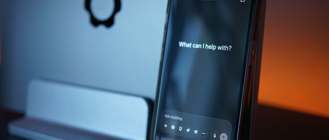Close-up of a smartphone with AI chat interface, showcasing advanced technology in a sleek design.