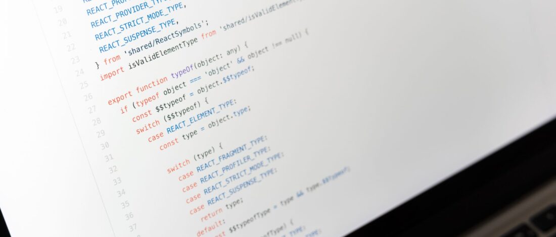 Close-up of JavaScript code on a laptop screen, showcasing programming in progress.