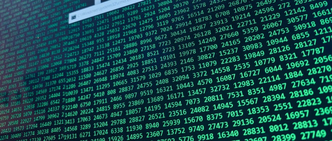 Vibrant green numbers on a computer screen, showcasing binary code and data streams.